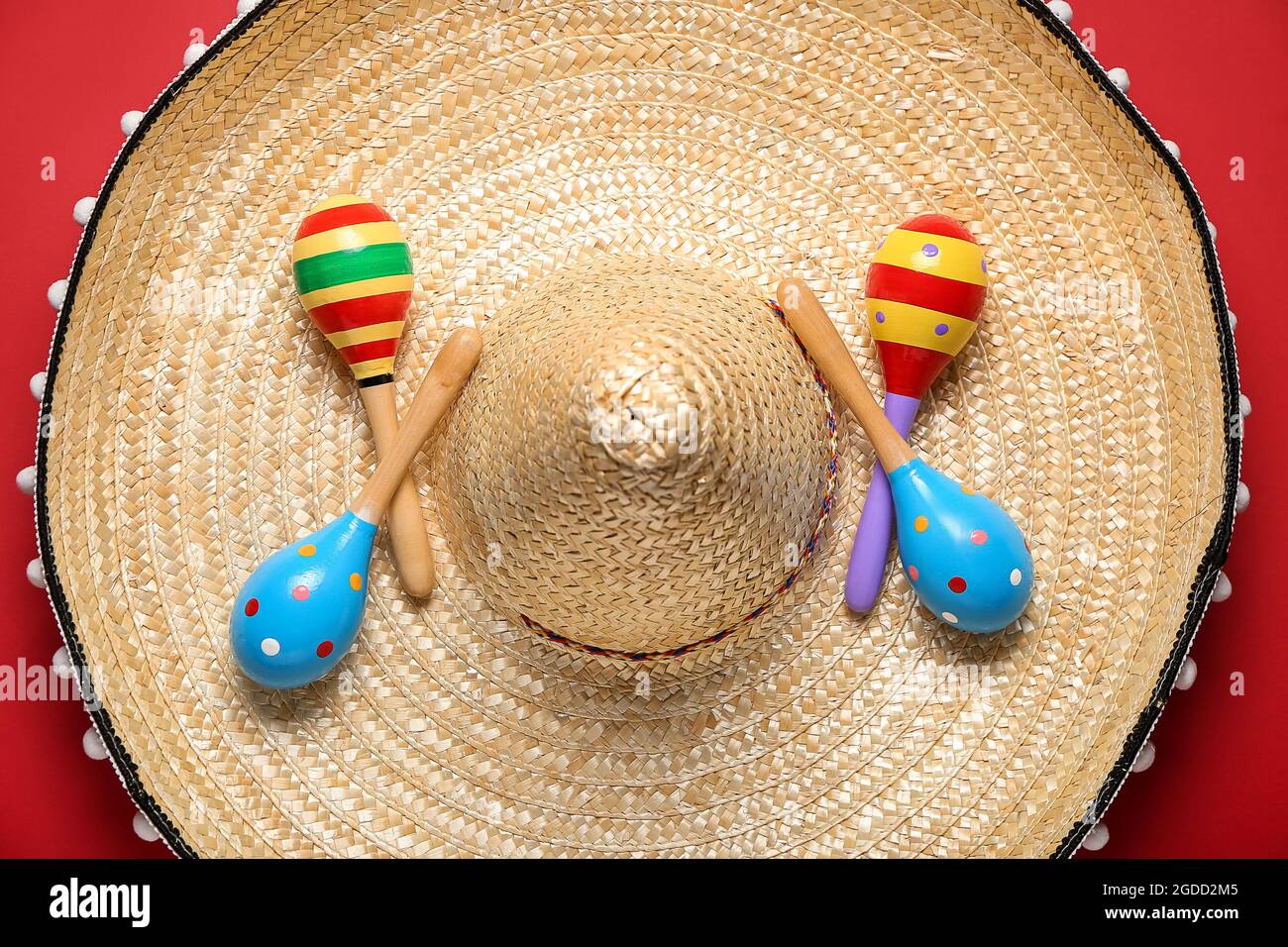 Mexican maracas and sombrero on color background Stock Photo Alamy