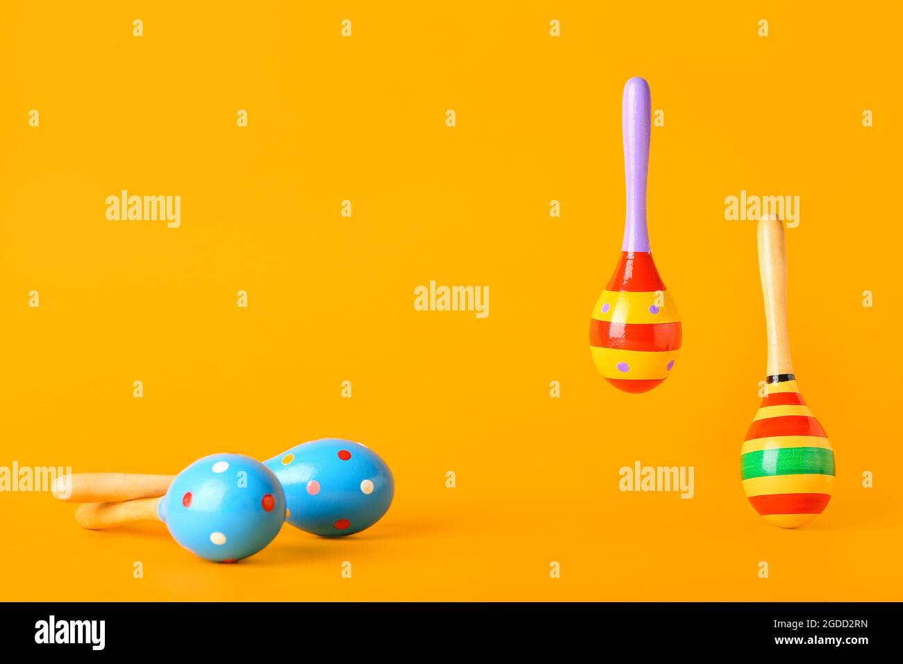 Mexican maracas on color background Stock Photo - Alamy