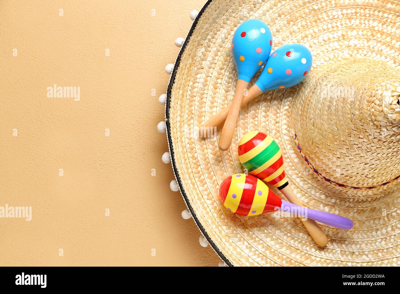 Mexican maracas and sombrero on color background Stock Photo Alamy