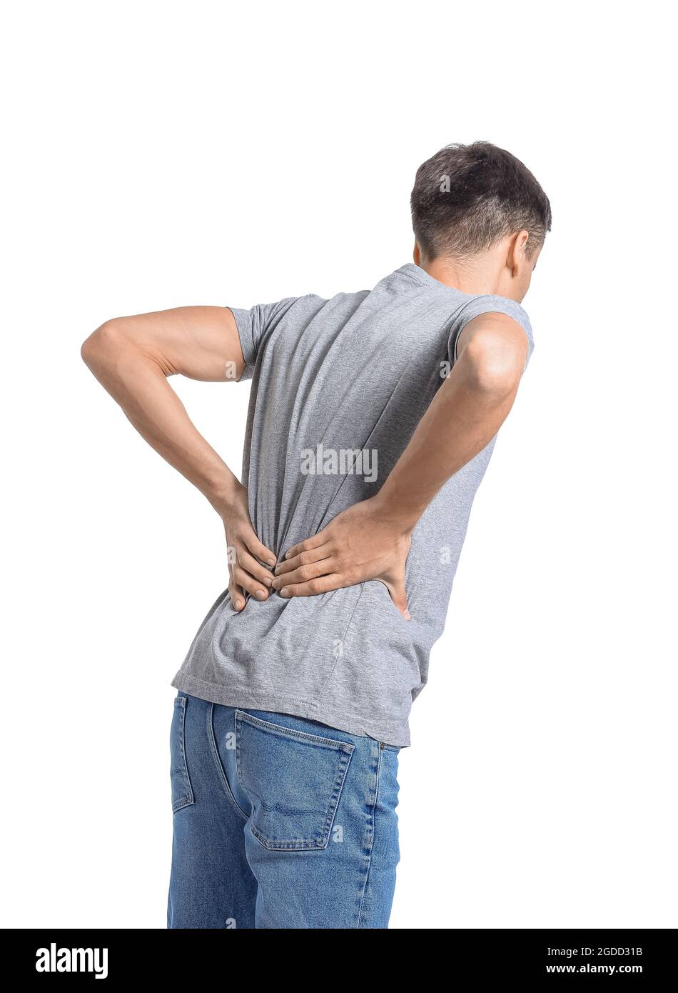 Young man suffering from back pain on white background Stock Photo - Alamy