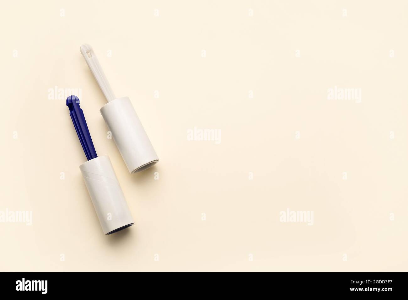 Lint rollers on color background Stock Photo
