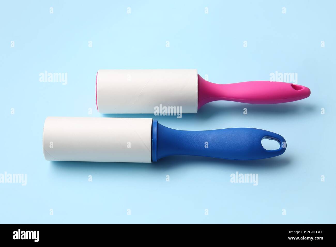 Lint rollers on color background Stock Photo