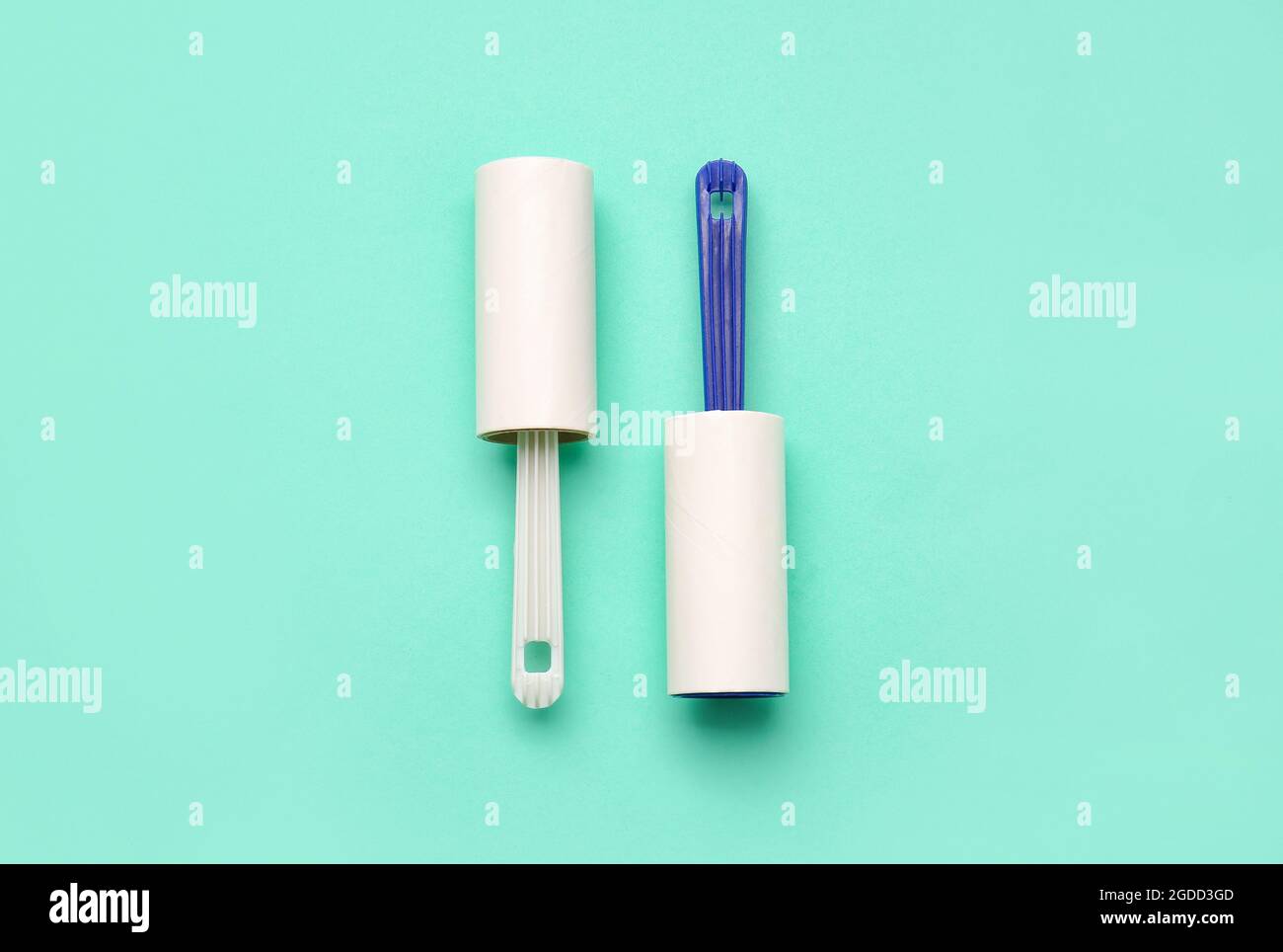 Lint rollers on color background Stock Photo