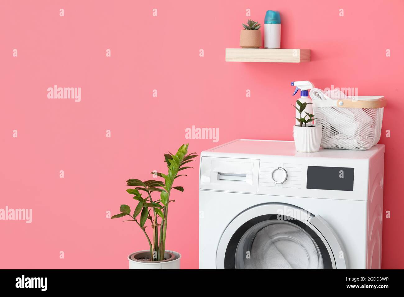 Modern washing machine with laundry in bathroom Stock Photo Alamy