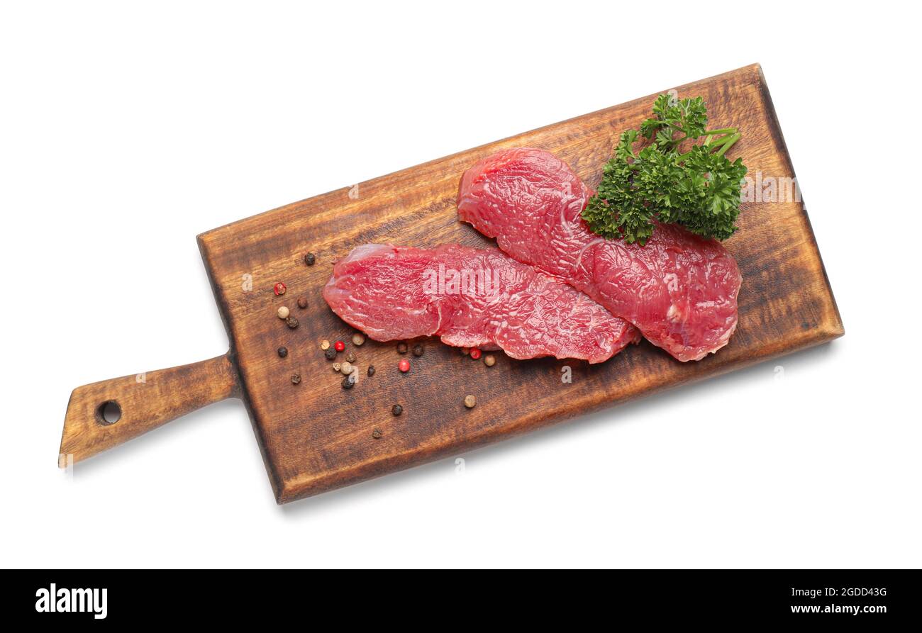 Wooden board with raw beef meat on white background Stock Photo - Alamy