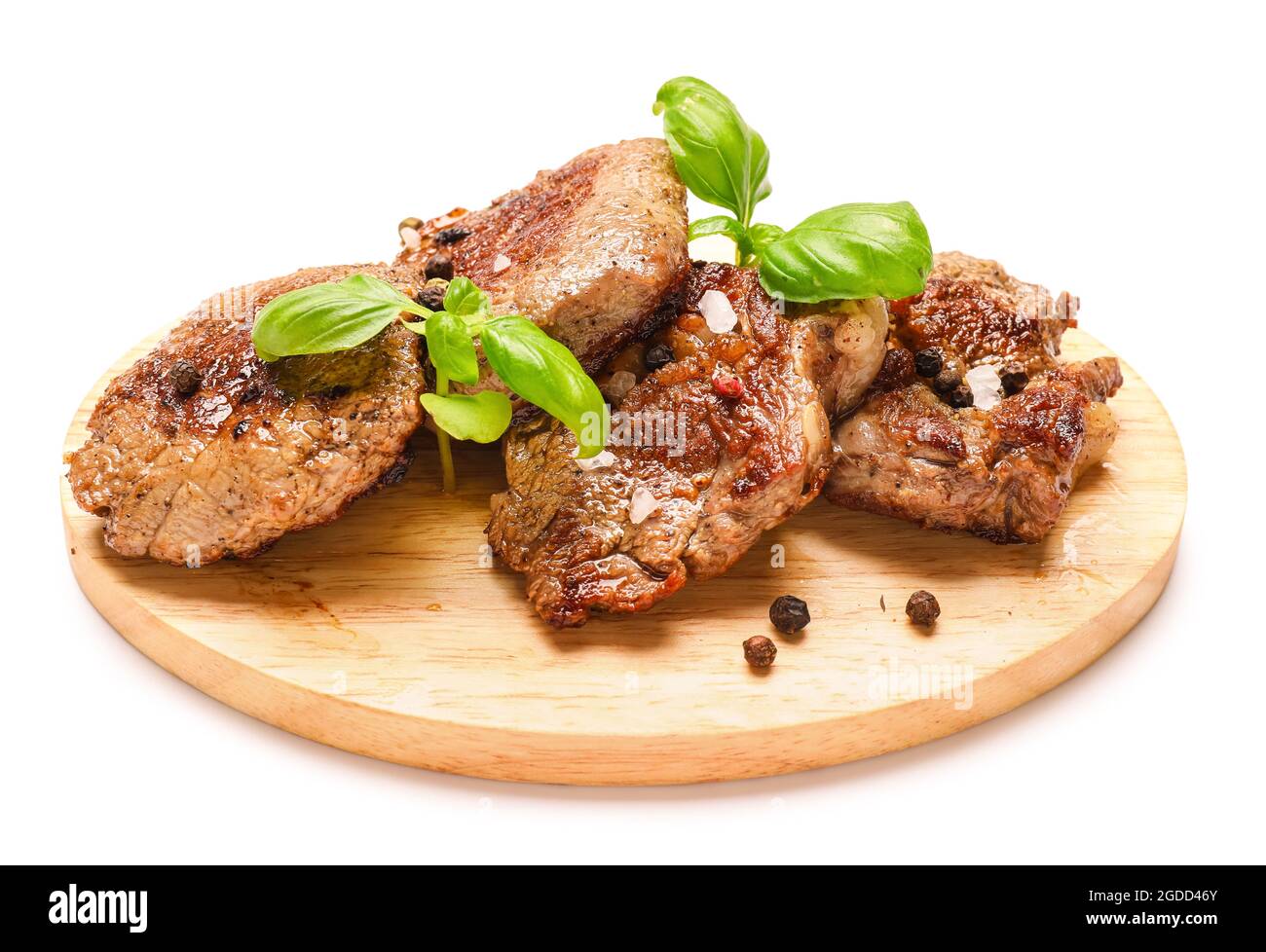 Wooden board tasty grilled beef on white background Stock Photo - Alamy