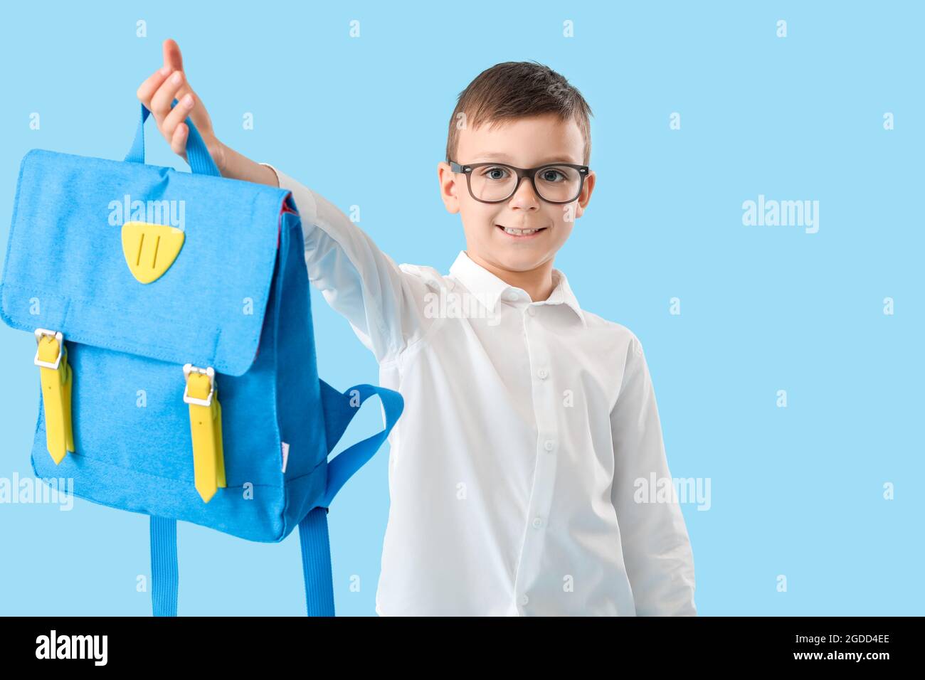 Little schoolboy with backpack on color background Stock Photo - Alamy