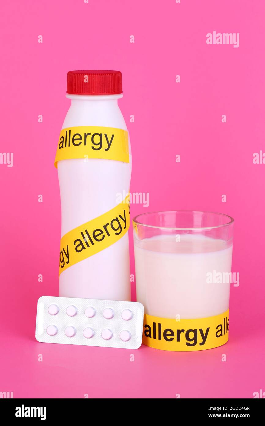 Milk allergy on pink background Stock Photo Alamy