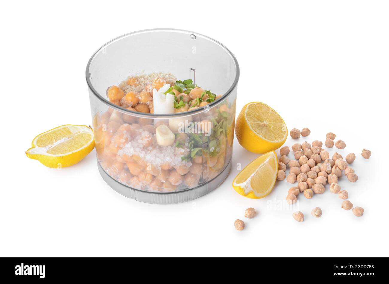 Blender with chickpea and ingredients for hummus on white background