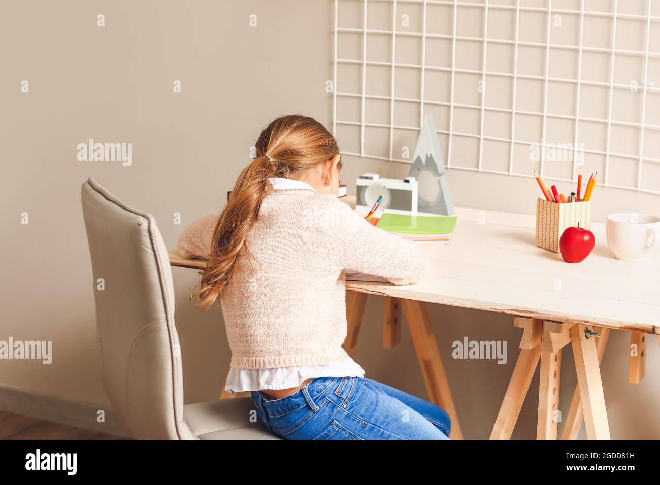 Little girl studying at home Stock Photo - Alamy