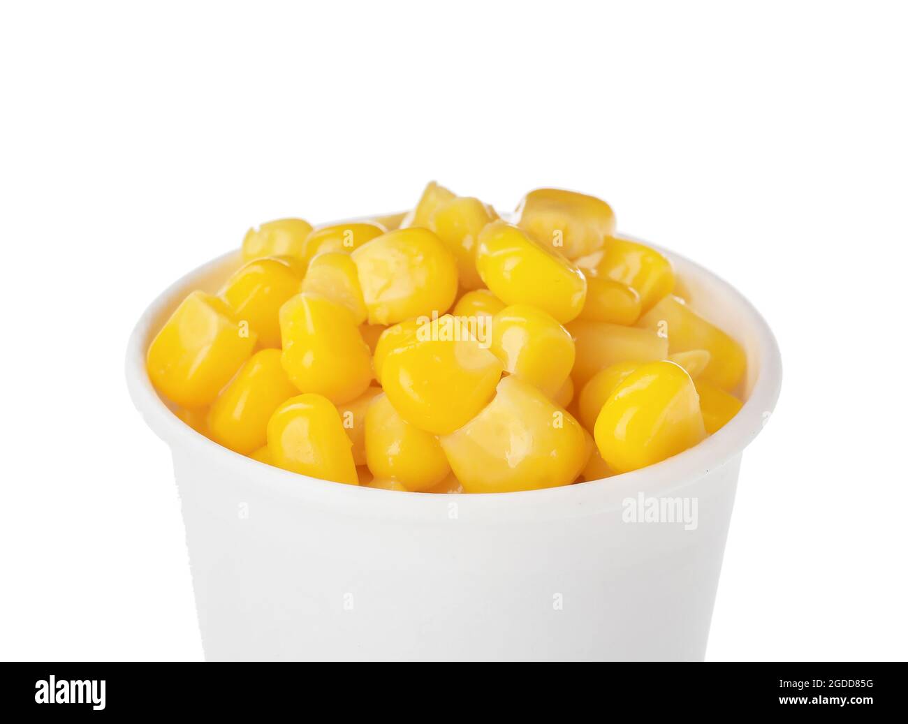 Paper cup of corn kernels on white background Stock Photo - Alamy