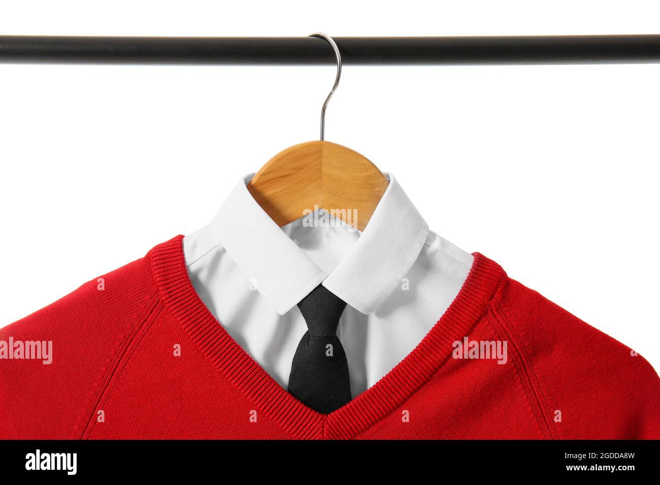 Hanger with stylish school uniform on white background Stock Photo - Alamy