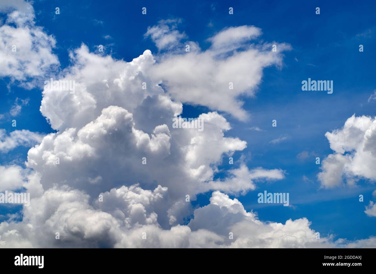 Blue sky with fluffy clouds Stock Photo - Alamy