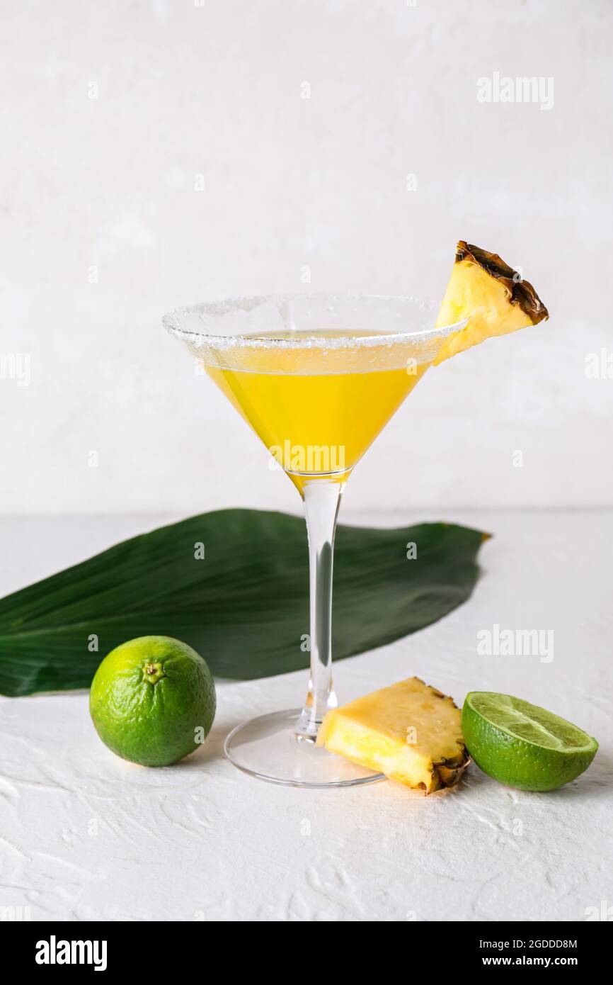 Glass of pineapple daiquiri cocktail on light background Stock Photo ... Glass of pineapple daiquiri cocktail on light background Stock Photo ...