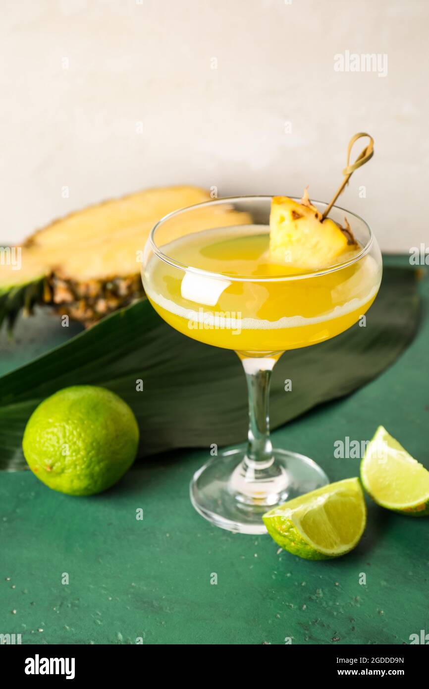 Glass of pineapple daiquiri cocktail on light background Stock Photo ... Glass of pineapple daiquiri cocktail on light background Stock Photo ...