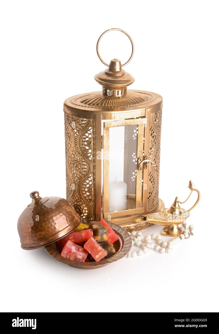 Muslim lantern with Aladdin lamp and Turkish sweets on white background Stock Photo