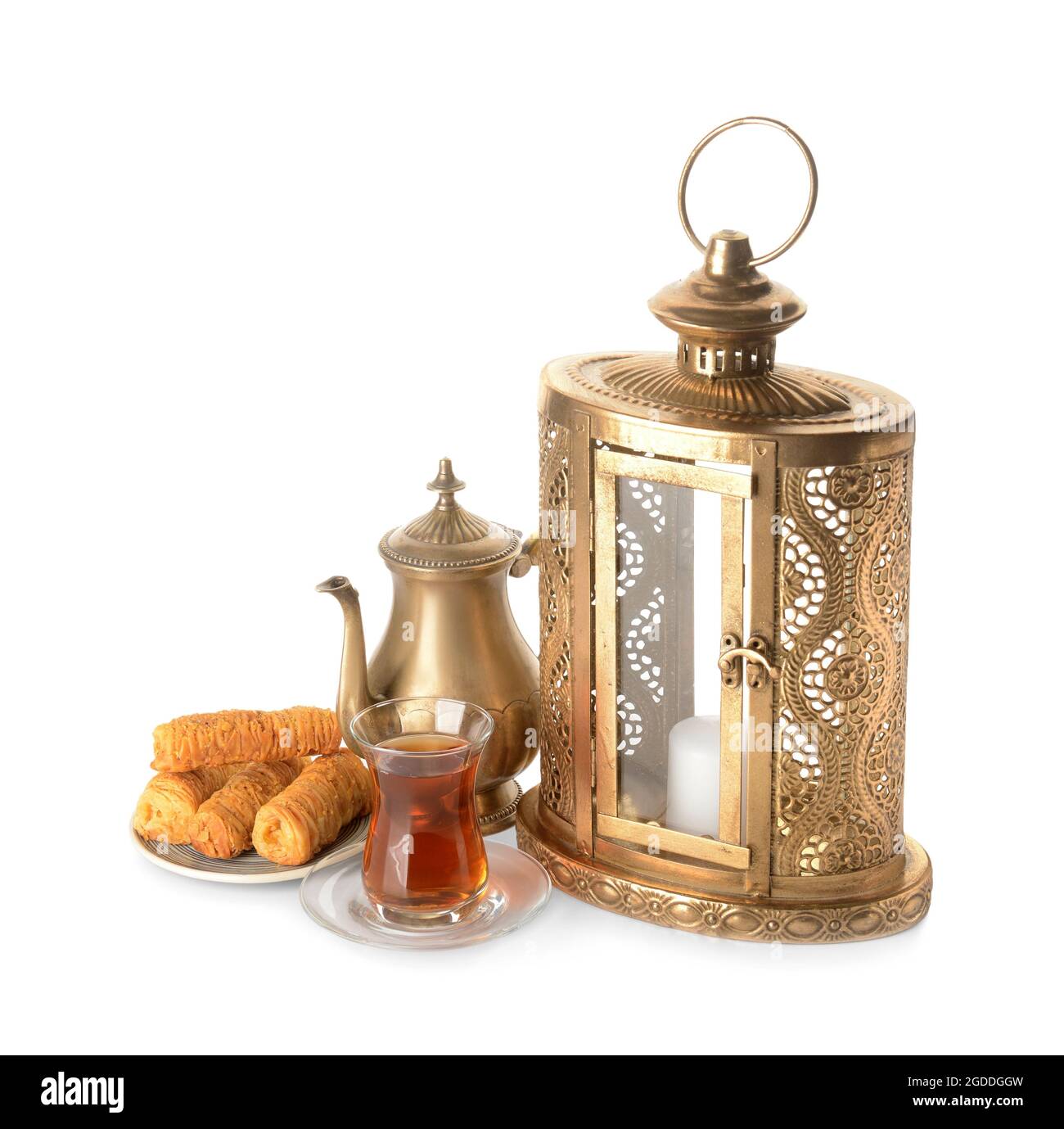 Muslim lantern with Turkish sweets and tea on white background Stock Photo