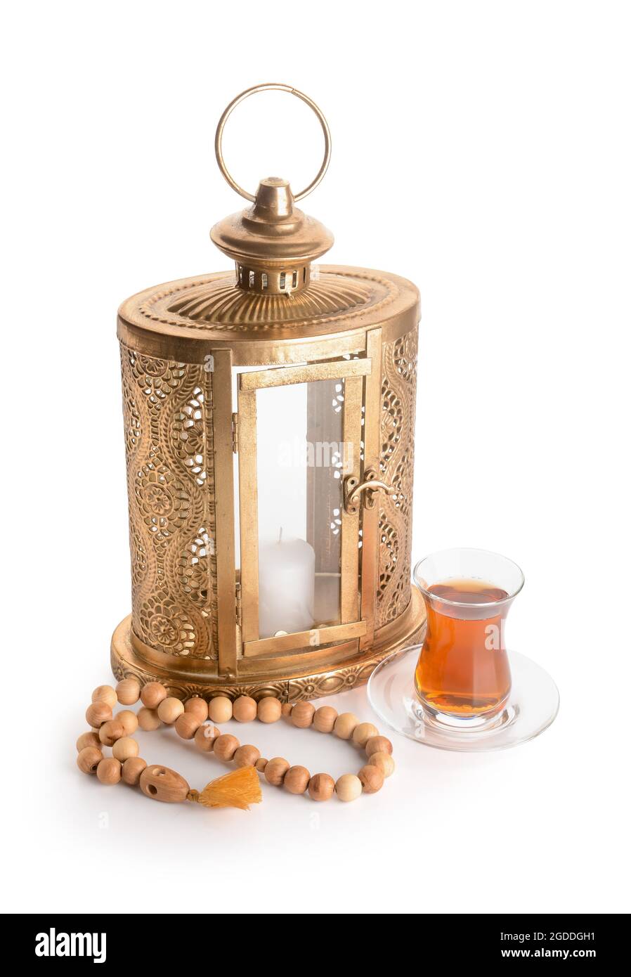 Muslim lantern with tasbih and Turkish tea on white background Stock Photo