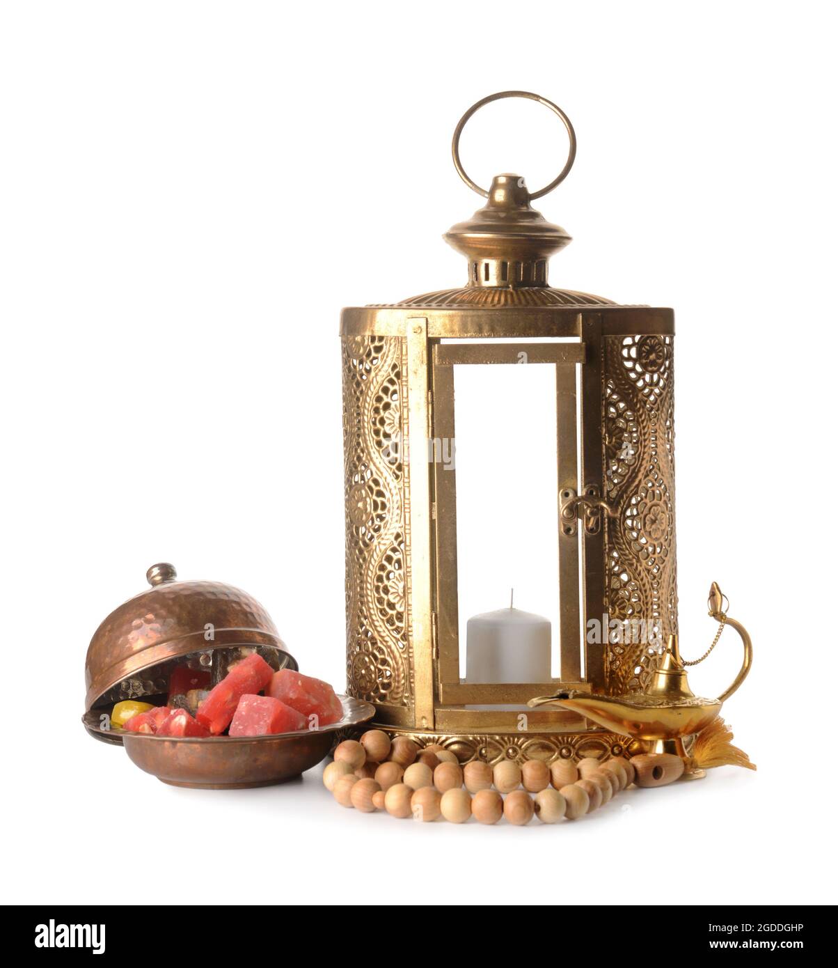 Muslim lantern with Aladdin lamp, tasbih and Turkish sweets on white background Stock Photo