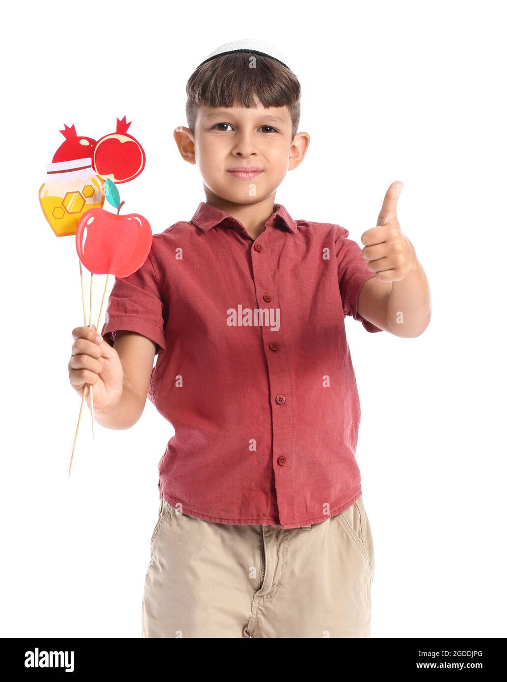 Little boy with decor for Rosh Hashanah (Jewish New Year) showing thumb ...