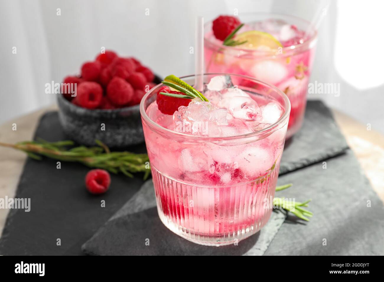 Glasses of tasty raspberry lemonade on table Stock Photo - Alamy