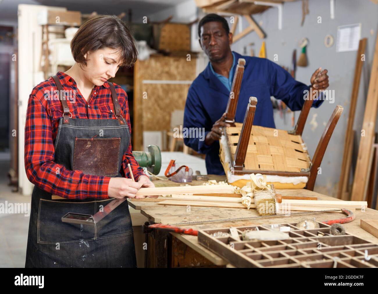 Restorers working with wooden furniture Stock Photo Alamy