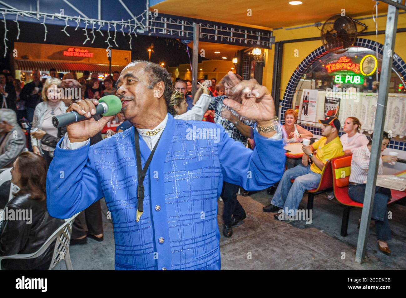 Miami Florida,Little Havana,Calle Ocho El Pub Viernes Culturales,Hispanic man male singing sings traditional Cuban songs microphone, Stock Photo