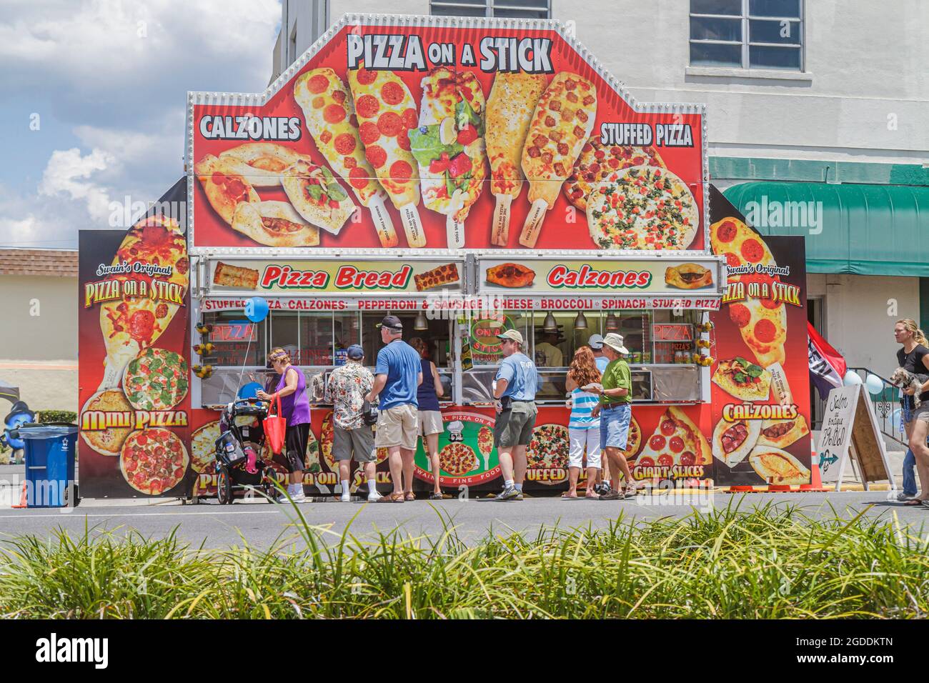 Florida Brooksville Florida Blueberry Festival line queue,carnival food vendor stall booth pizza on a stick customers, Stock Photo