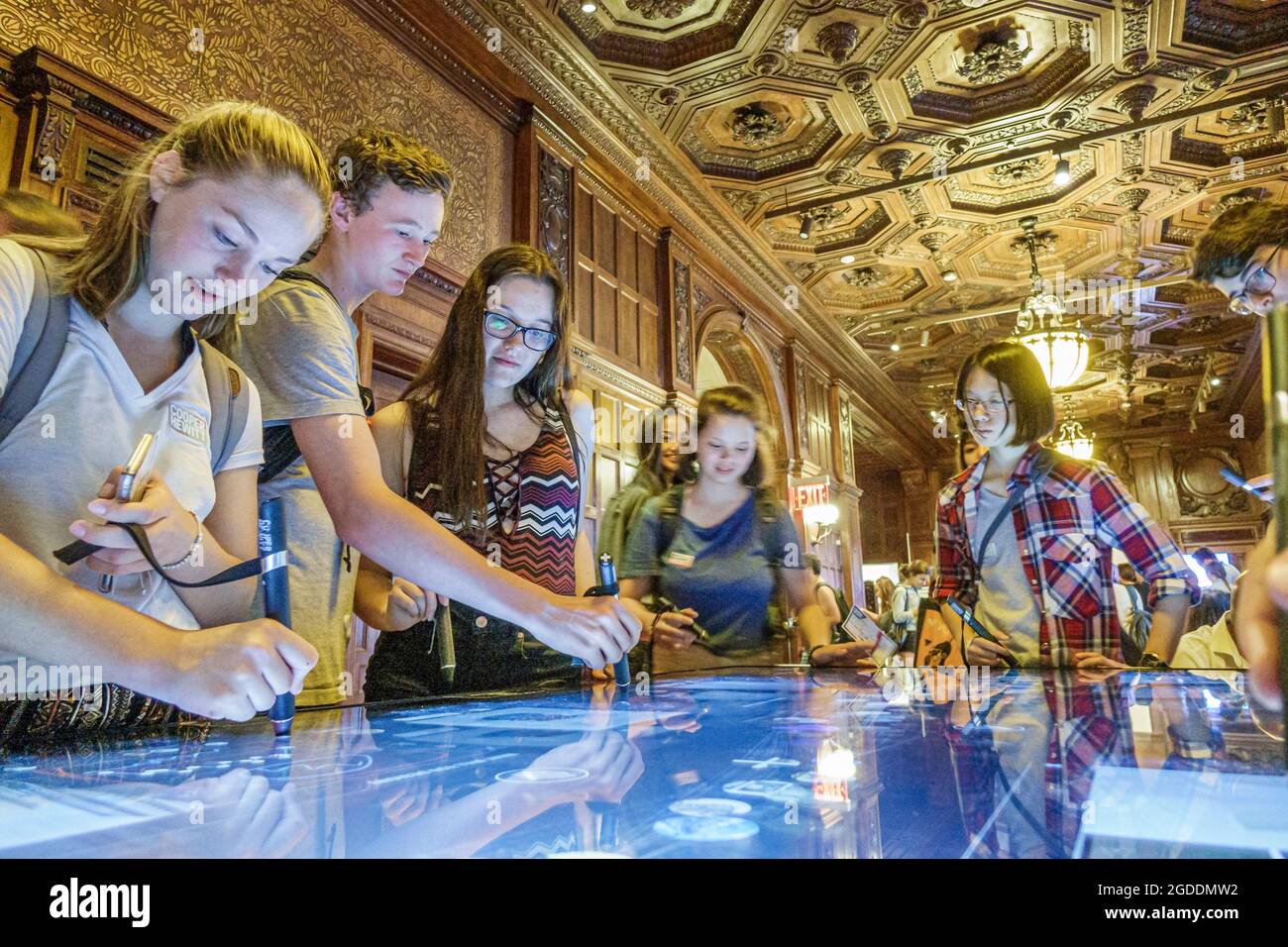 New York City,NY NYC Manhattan Upper East Side,Carnegie Mansion Cooper Hewitt Design Museum interactive pen,touchscreen table girls female male boys t Stock Photo