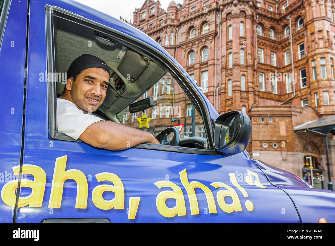 UK England Lancashire,Manchester Lower Mosley Street Middle Eastern Muslim taxi cab driver, Stock Photo