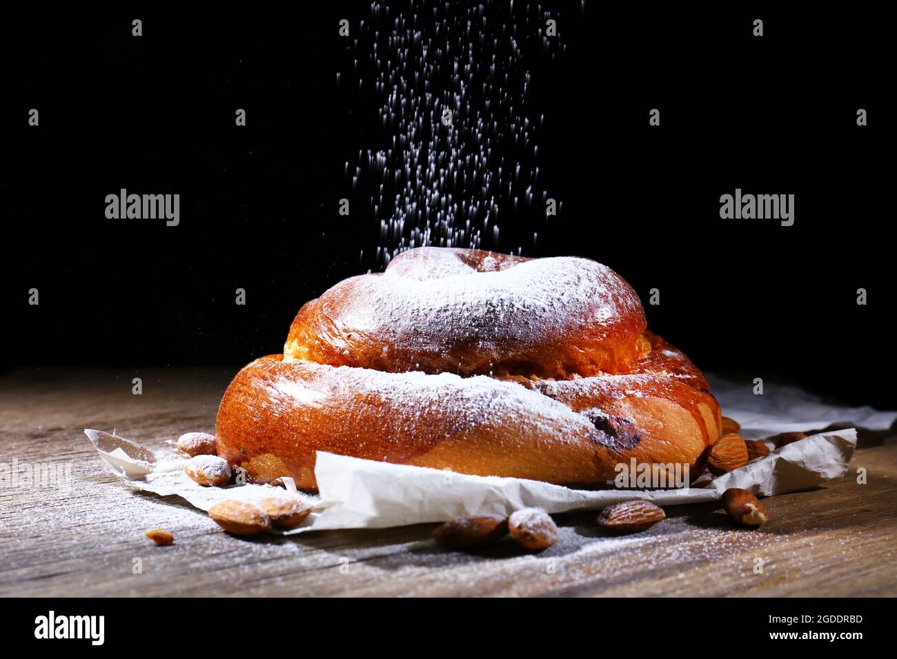 Tasty cake on table on black background Stock Photo - Alamy