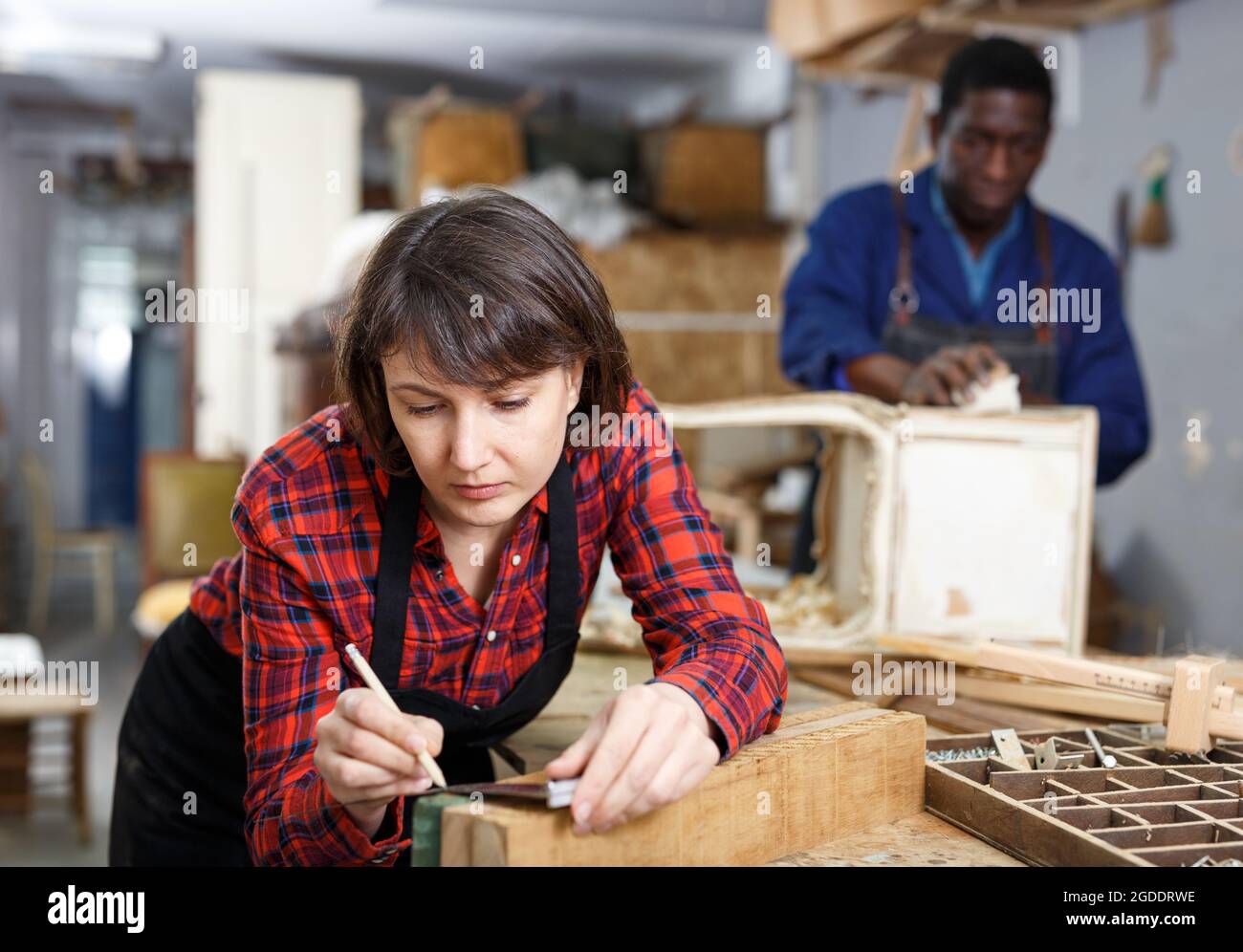 Female restorer working with furniture Stock Photo Alamy