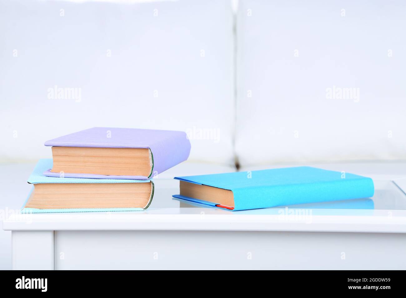 Books on coffee table in room Stock Photo Alamy