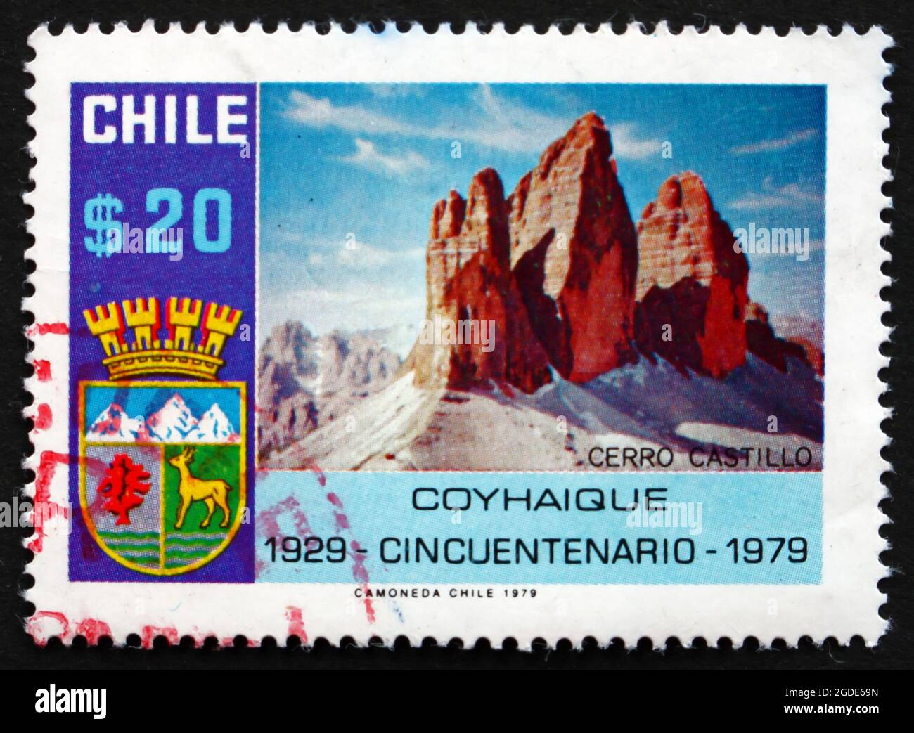 CHILE - CIRCA 1979: a stamp printed in the Chile shows Coat of Arms and Mt. Castillo, 50th Anniversary of Coyhaique, City in Patagonia, circa 1979 Stock Photo