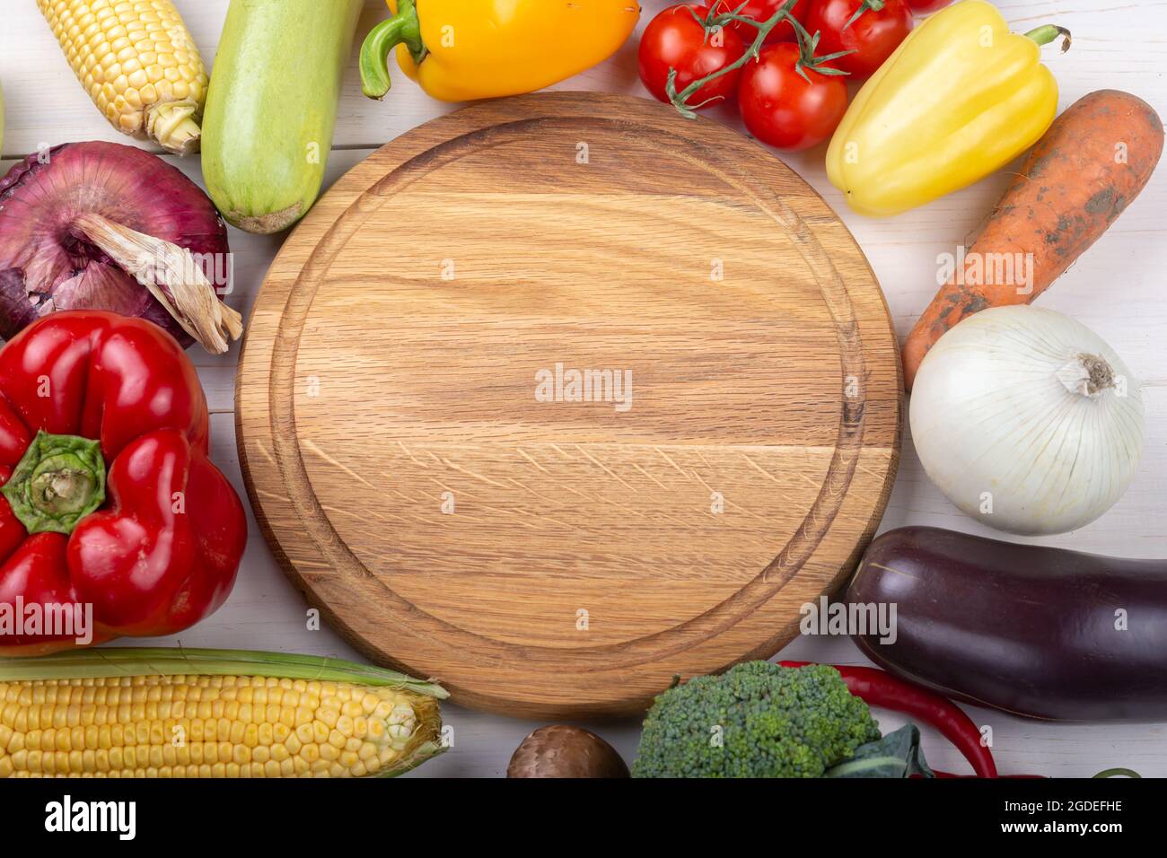 Healthy eating. Vegetables on a white wooden table. Organic food frame ...