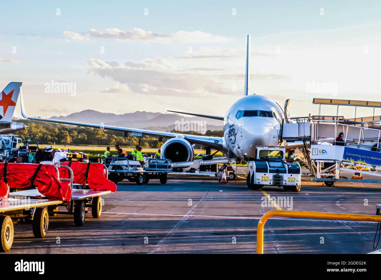 Passengers unloading luggage hi-res stock photography and images - Alamy