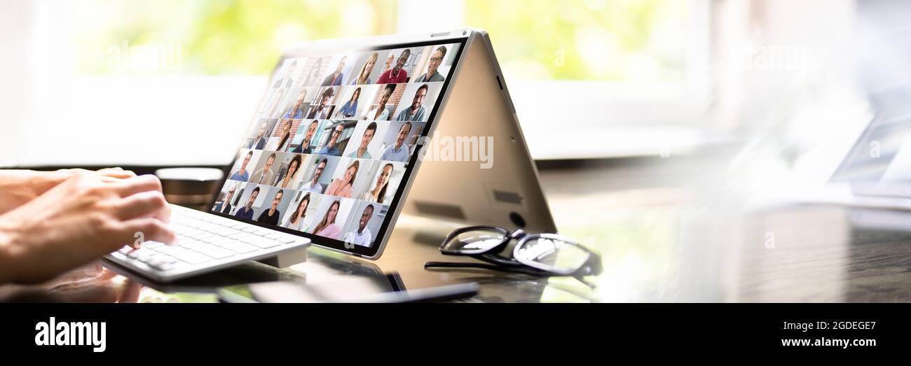 Online Video Conference And Digital Webinar On Screen Stock Photo