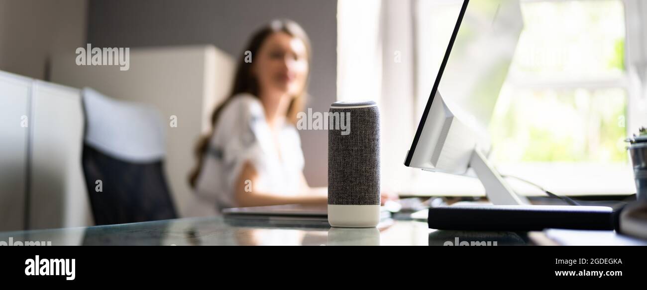 Voice Assistant And Control. Speaker Device In Office Stock Photo