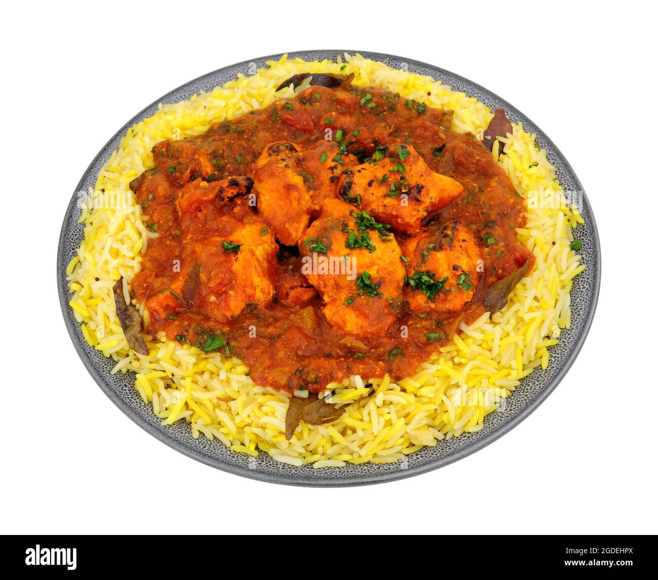 Indian chicken jalfrezi curry meal with fragrant pilau rice isolated on a white background Stock Photo