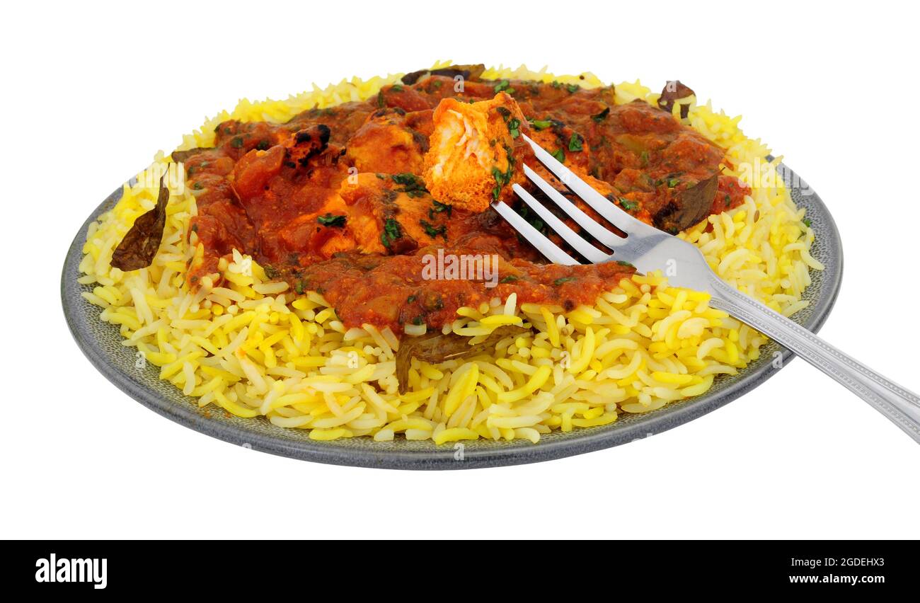 Indian chicken jalfrezi curry meal with fragrant pilau rice isolated on a white background Stock Photo