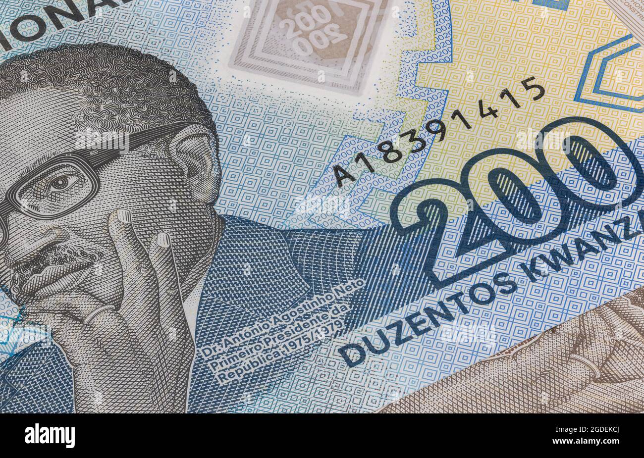Close up to 500 Kwanza of the Republic of Angola. Polymer banknotes of the African country. Detailed capture of the portrait of the first president Ag Stock Photo