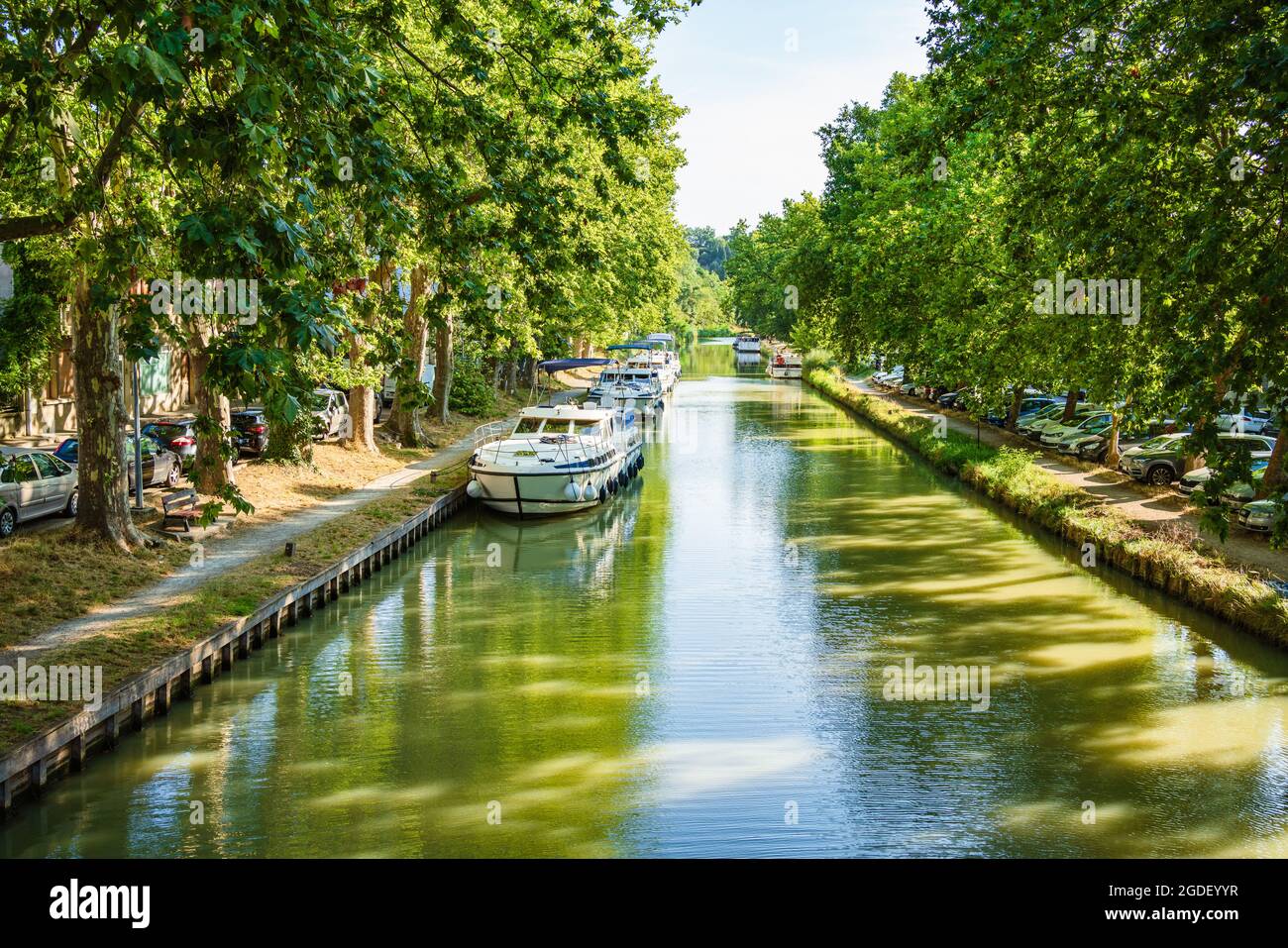 Boats moored in the Canal du Midi in Carcassonne, France. Stock Photo