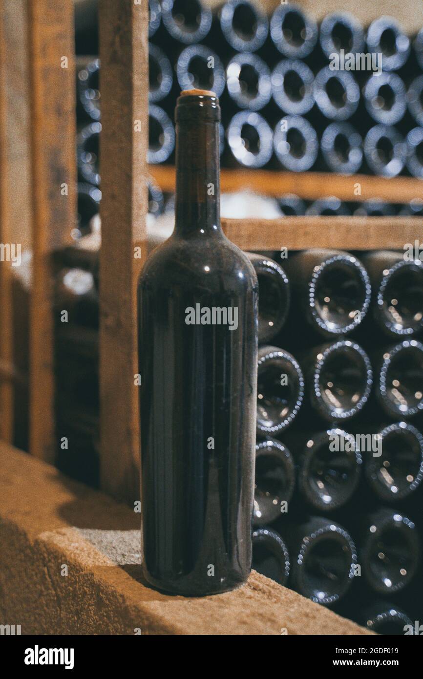Aged red wine bottle in cellar Stock Photo Alamy