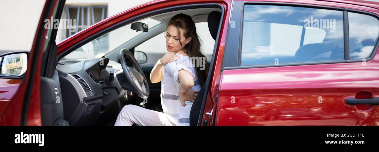 Injury And Car Accident. Whiplash And Hurt Back Stock Photo