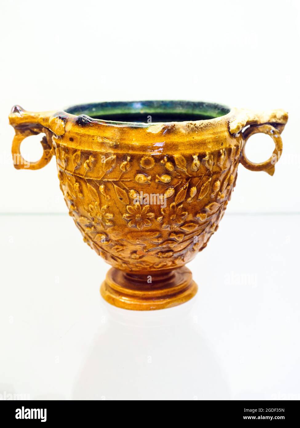 Kantharoi (deep wine cup) decorated with vegetal motifs - Lead-glazed terracotta from Pompeii - 1st century AD Stock Photo