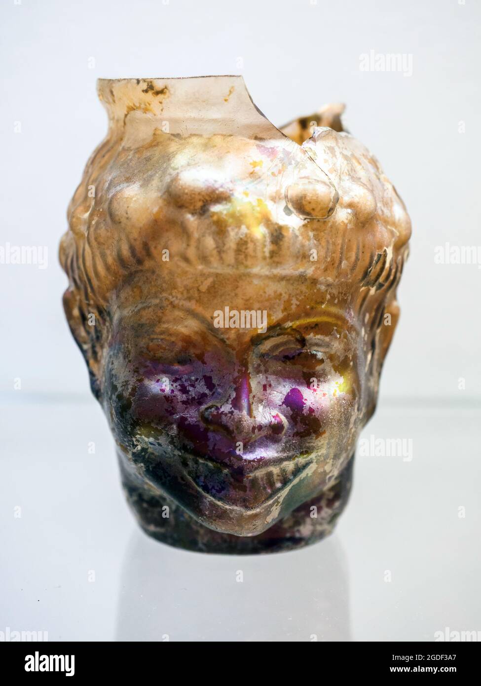 Ampoleus used to contain perfumed ointments in the shape of an African black man's head Mold-blown glass from Pompeii and vesuvian area - 1st century AD Stock Photo