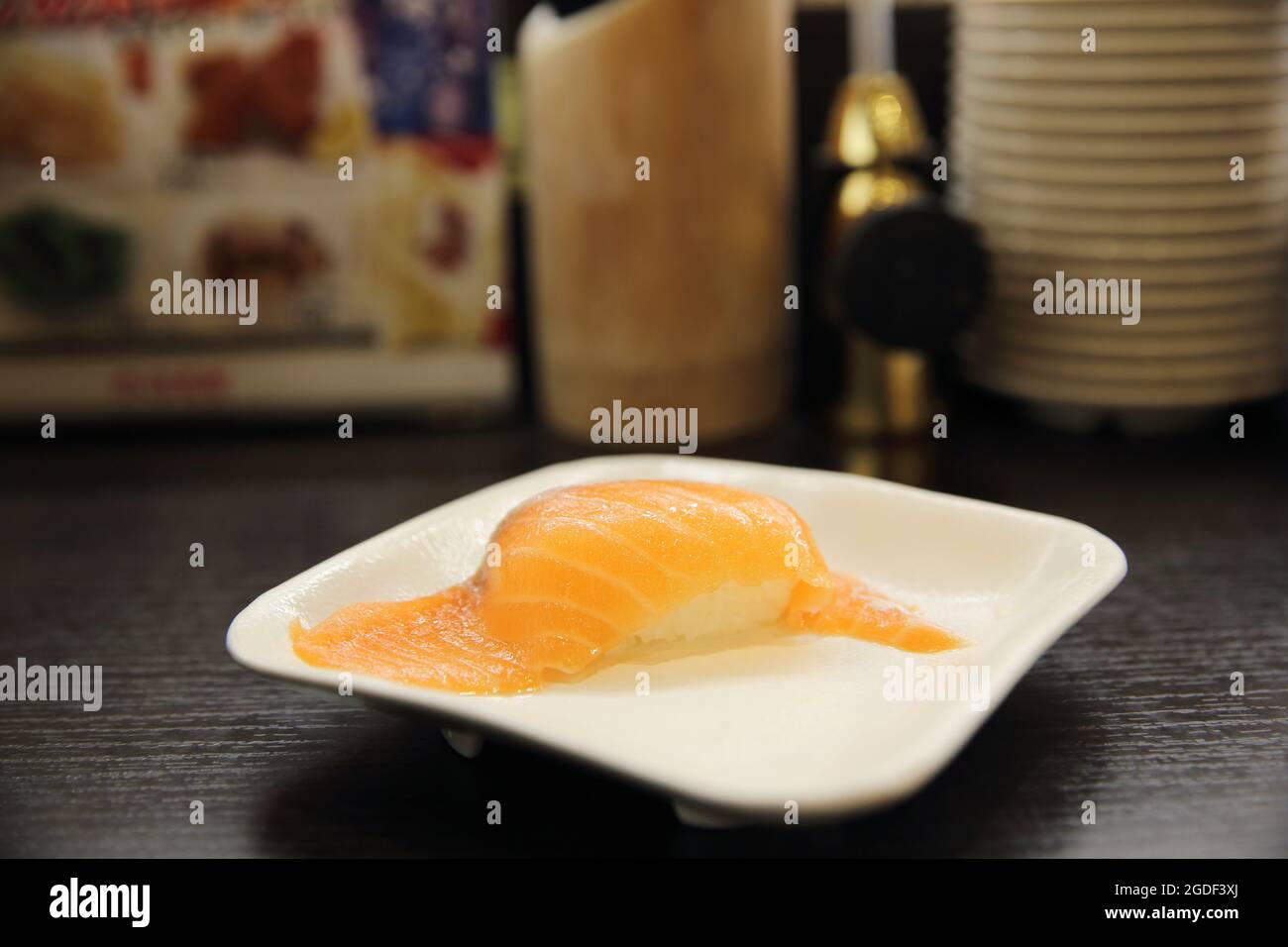 Salmon Sushi in japanese sushi restaurant Stock Photo - Alamy