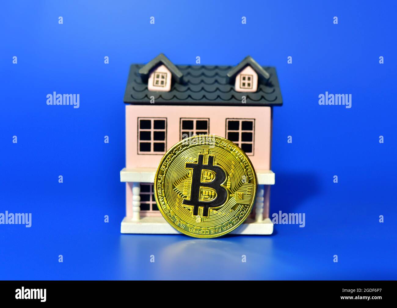 Bitcoin coin on the background of a wooden house. The concept of buying  real estate and housing for cryptocurrency.BTC Crypto mining and investing.  Bl Stock Photo - Alamy