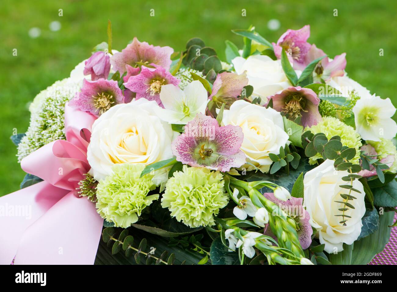 Heart flower bouquet with helleborus flowers Stock Photo - Alamy