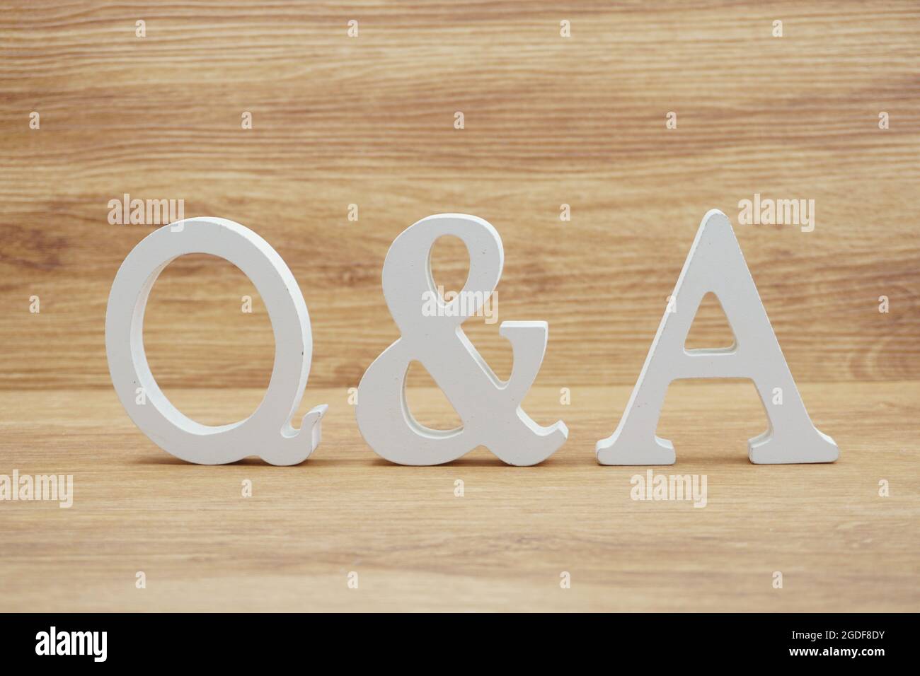 Q&A alphabet letters on wooden background Stock Photo - Alamy